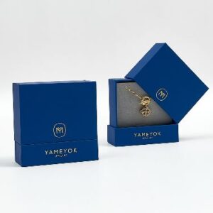 Elegant blue jewelry box with luxurious gold detailing for premium accessories.