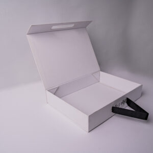 A sleek, white luxury magnetic closure box with a black ribbon pull tab, ideal for premium packaging and gifting.