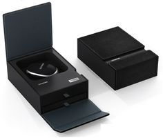 Elegant black magnetic closure box with drawer and protective insert for luxury items.