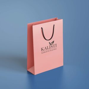 The paper bag has a sleek, minimalistic design ideal for premium retail packaging.