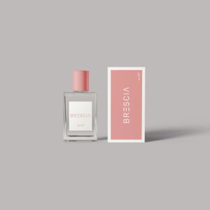 Minimalist perfume packaging featuring a sleek perfume bottle with a matching pink and white box, offering a clean and elegant design.