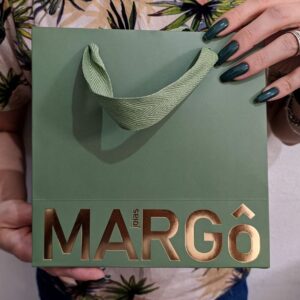 Green luxury paper bag with gold foil logo and durable fabric handle